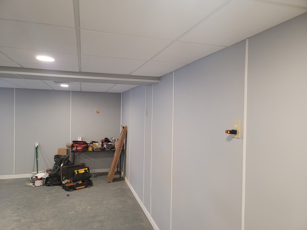 Freshly panelled and drywalled basement renovation in progress